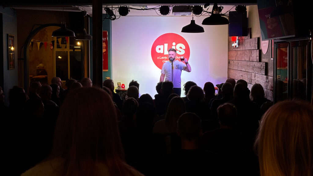 Rich J Wall on stage at Thread for A Laugh In Stockport comedy club